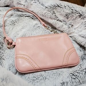 Coach small Pink Wristlet Perfect gift for 15 dollars. Little wear around corner